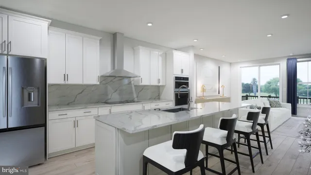 a kitchen with granite countertop white cabinets and stainless steel appliances