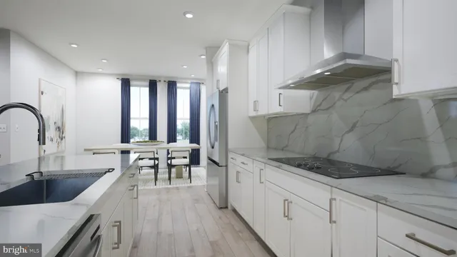 a kitchen with stainless steel appliances granite countertop a sink a stove and a wooden cabinets