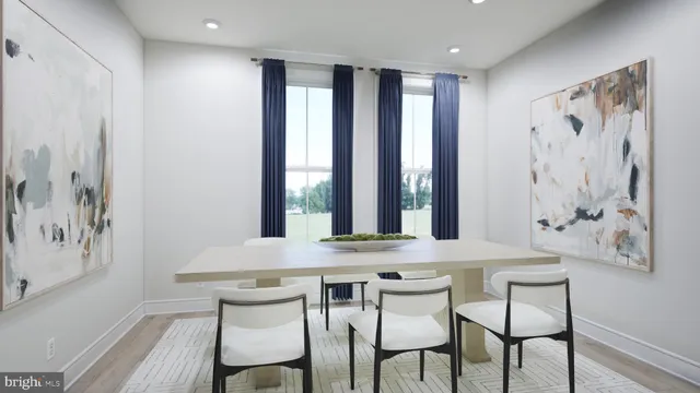 a view of a dining room with furniture and window