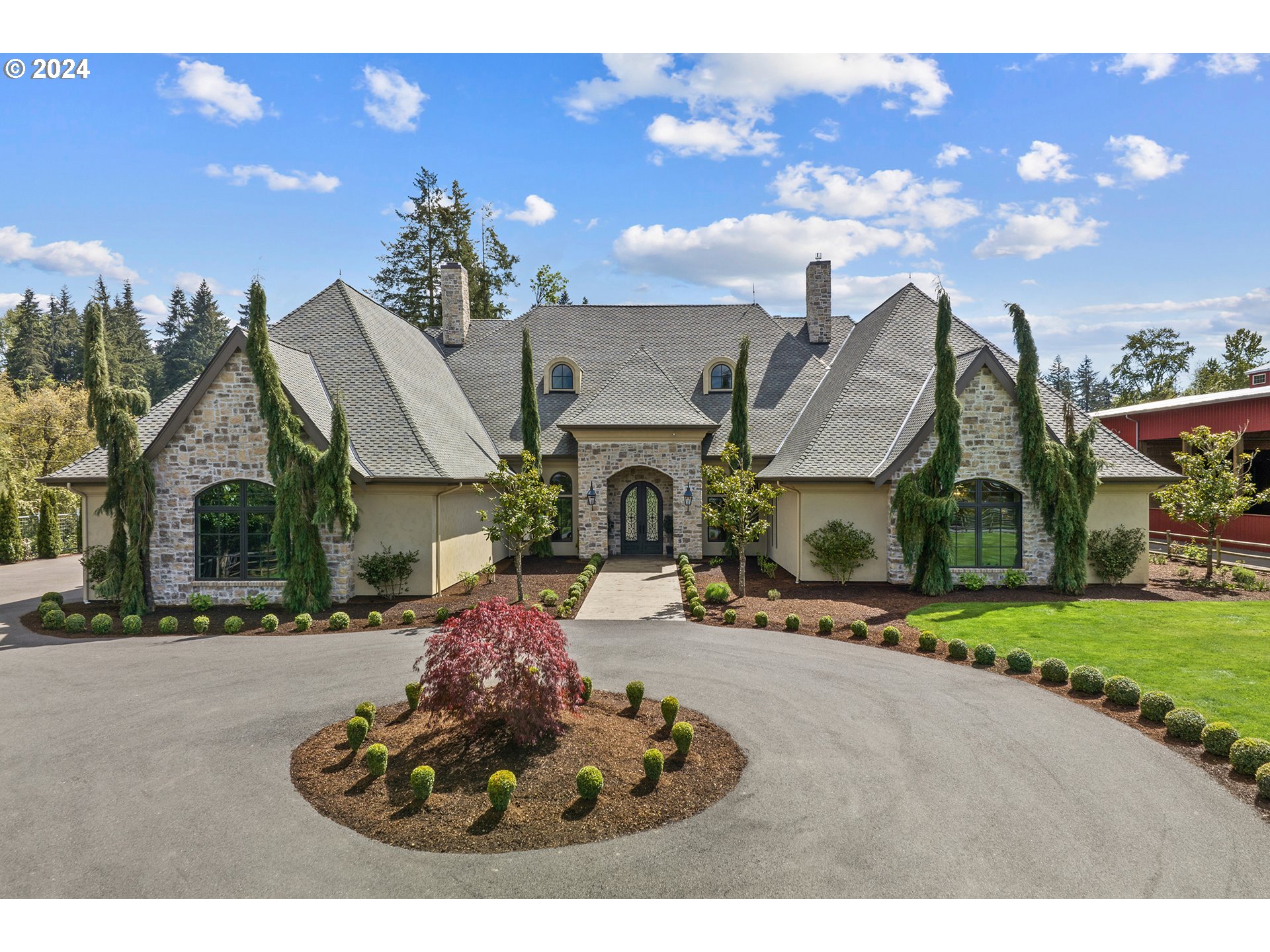 421 Northwest 209th Street Ridgefield, WA 98642 - Photo 1 of 48 a front view of a house with a garden