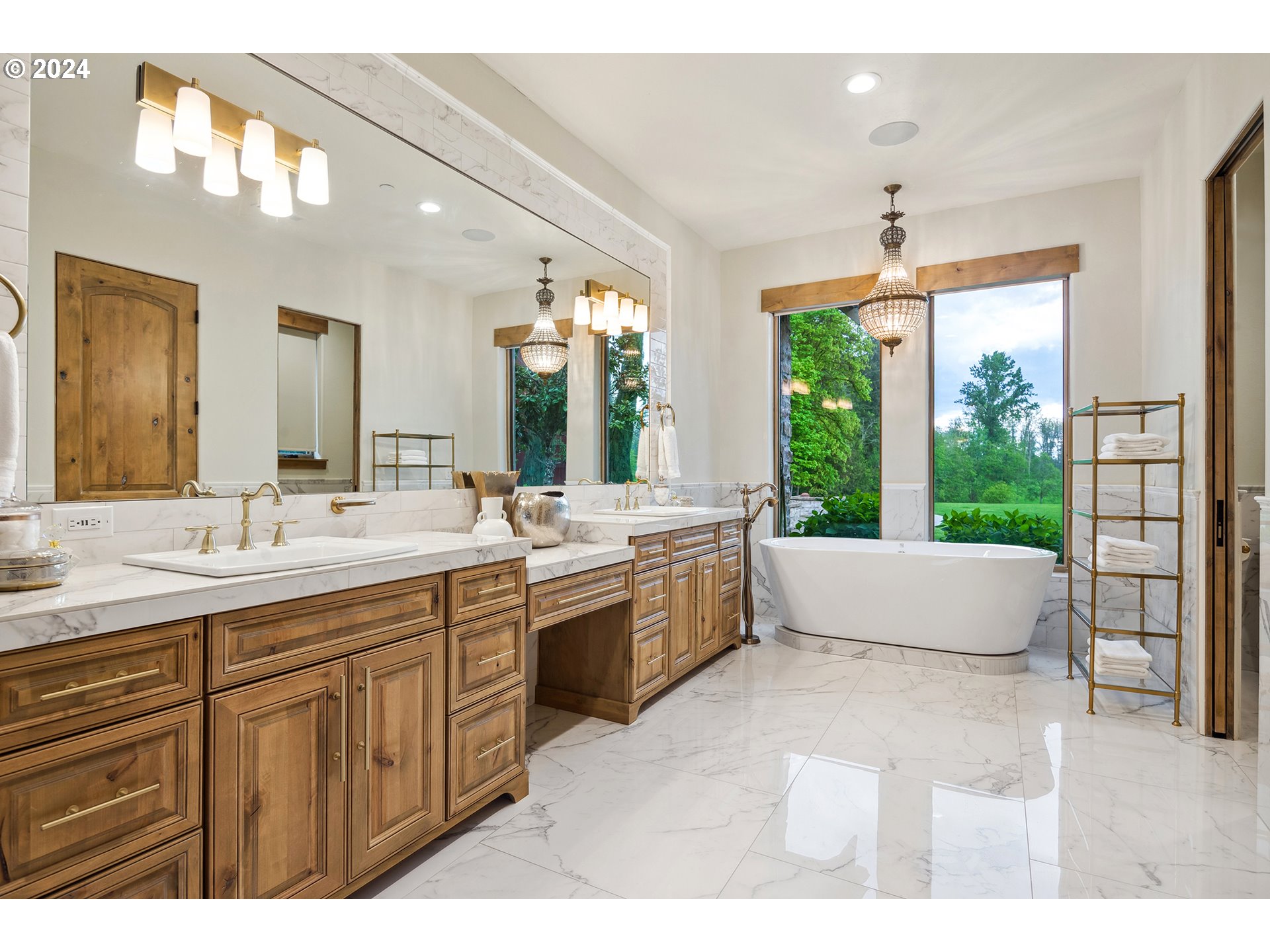 421 Northwest 209th Street Ridgefield, WA 98642 - Photo 11 of 48 a large bathroom with a large tub and sink