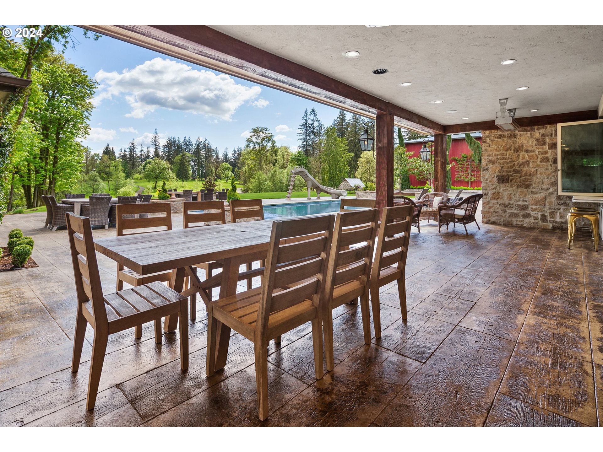 421 Northwest 209th Street Ridgefield, WA 98642 - Photo 26 of 48 a dining area with furniture and a floor to ceiling window
