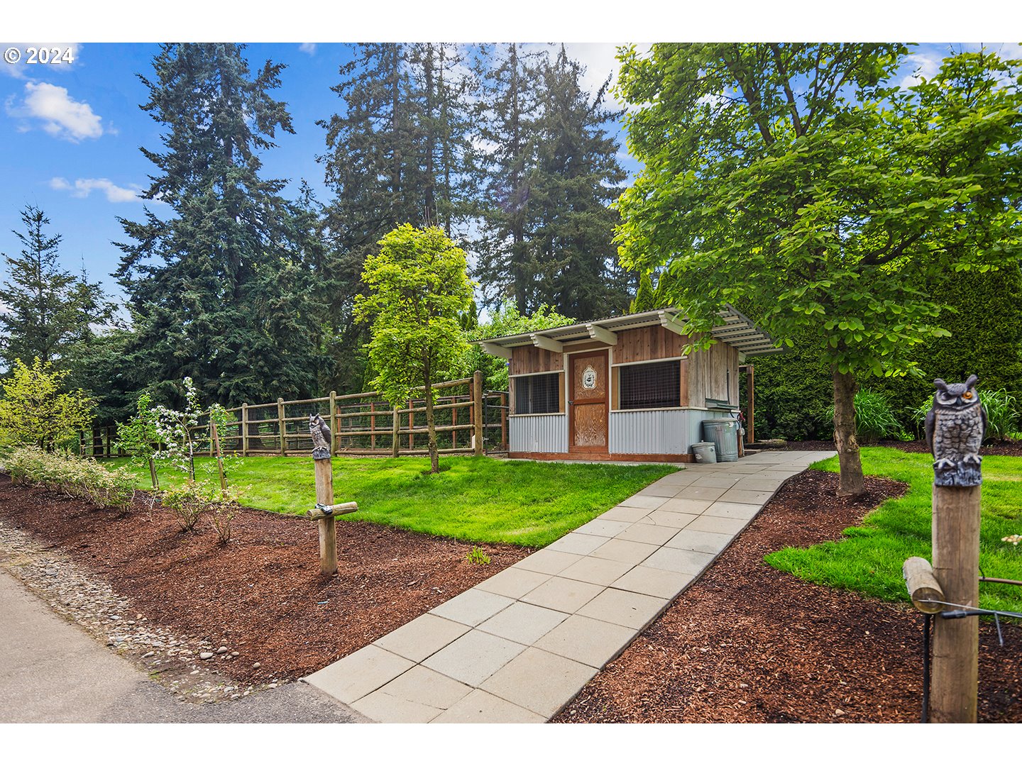 421 Northwest 209th Street Ridgefield, WA 98642 - Photo 34 of 48 a front view of a house with garden