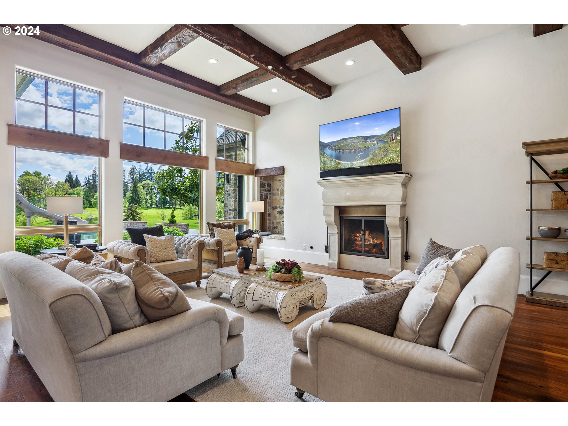 421 Northwest 209th Street Ridgefield, WA 98642 - Photo 4 of 48 a living room with furniture ceiling fan and a fireplace