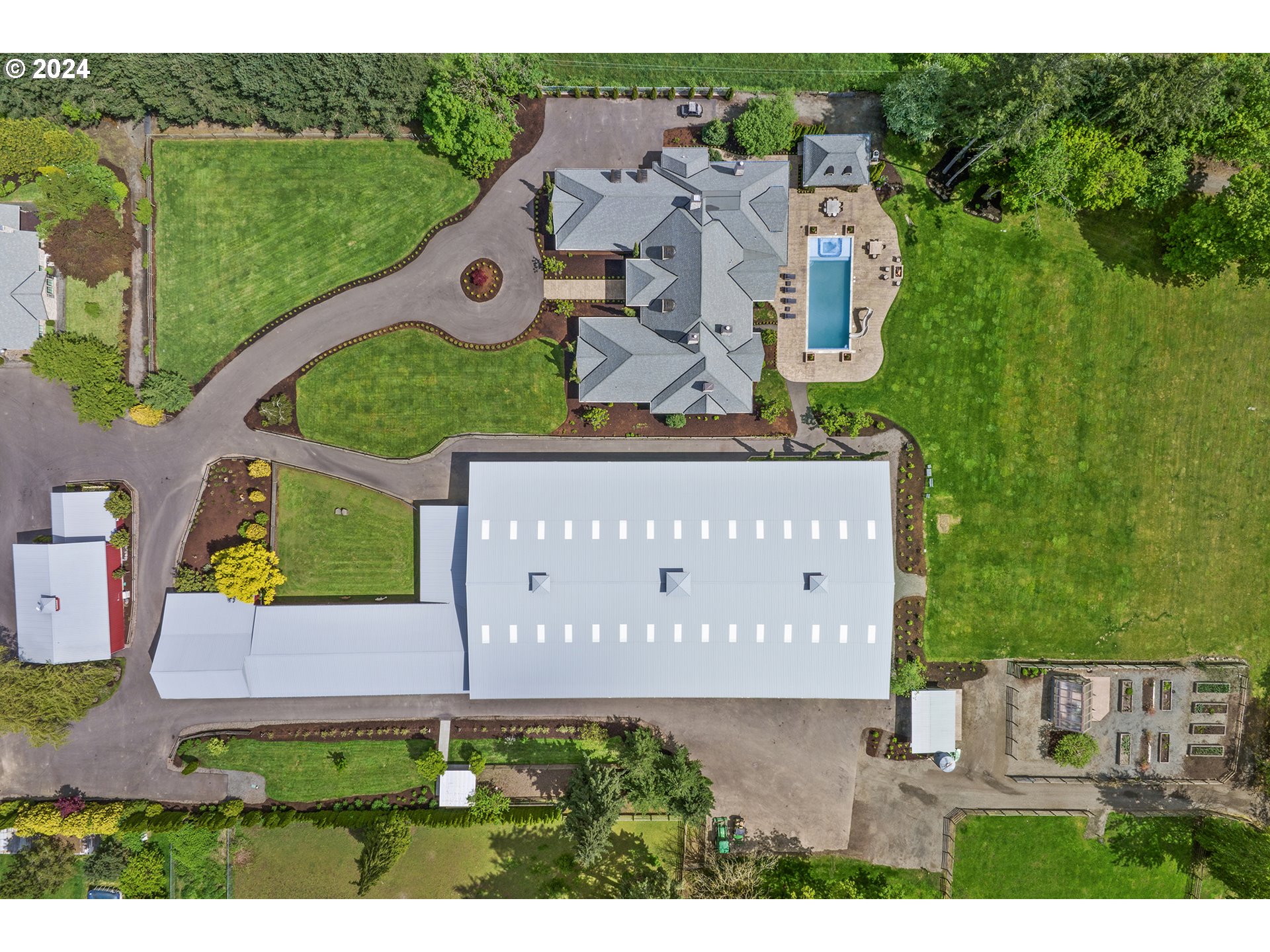 421 Northwest 209th Street Ridgefield, WA 98642 - Photo 48 of 48 an aerial view of a house with a garden and a sign board