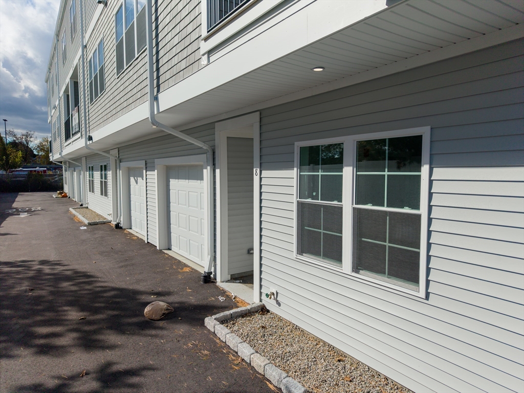 889-895 Grinnell Street, Unit 3 Fall River, MA 02721 - Photo 34 of 39 a view of a house with a door and a window