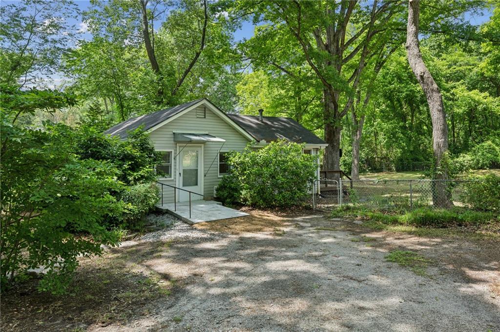 4202 Maplewood Drive Decatur, GA 30035 - Photo 1 of 1 a front view of a house with garden