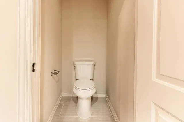 a bathroom with a toilet and a sink