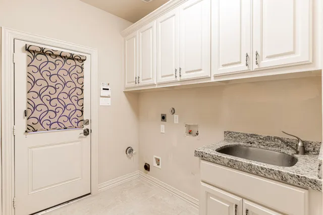 a bathroom with a sink and a window