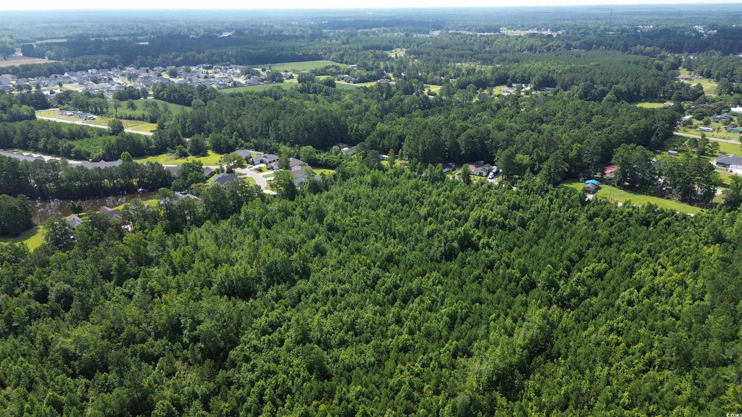 Tbd Elbow Road Longs, SC 29568 - Photo 2 of 14 Aerial overview of property's location featuring a forest