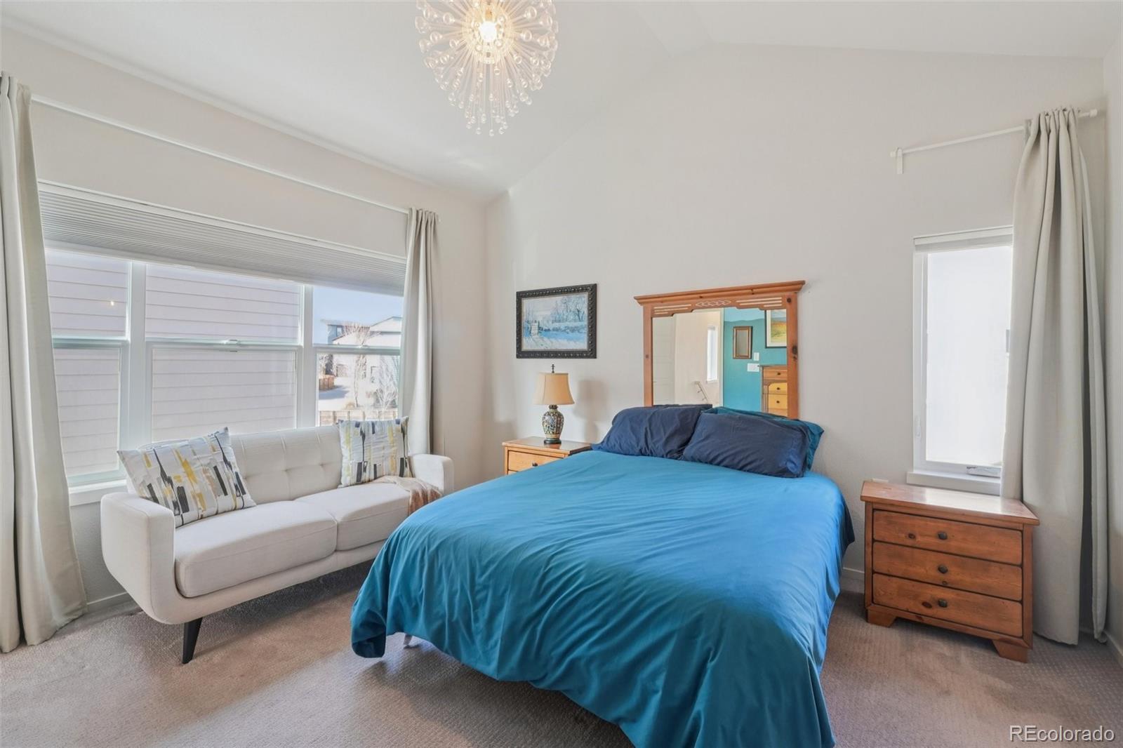 2005 West 66th Avenue Denver, CO 80221 - Photo 17 of 47 a bedroom with a bed and a dresser