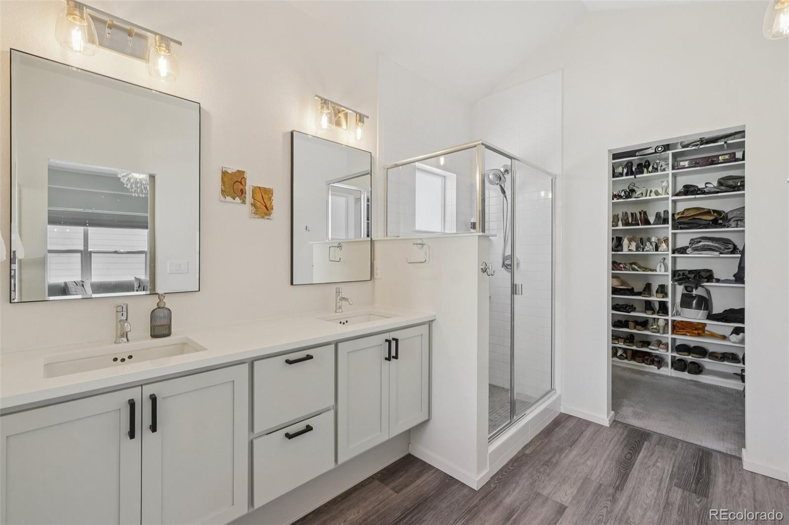 2005 West 66th Avenue Denver, CO 80221 - Photo 19 of 47 a kitchen with white cabinets and sink