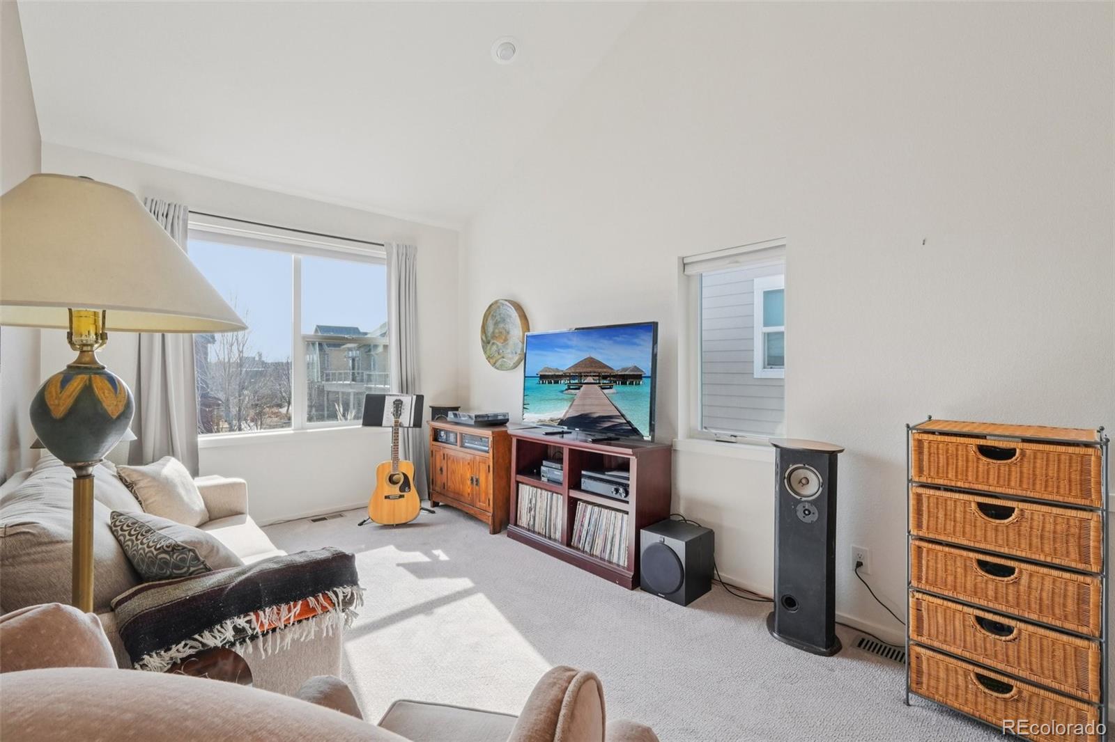 2005 West 66th Avenue Denver, CO 80221 - Photo 23 of 47 a living room with furniture and a flat screen tv