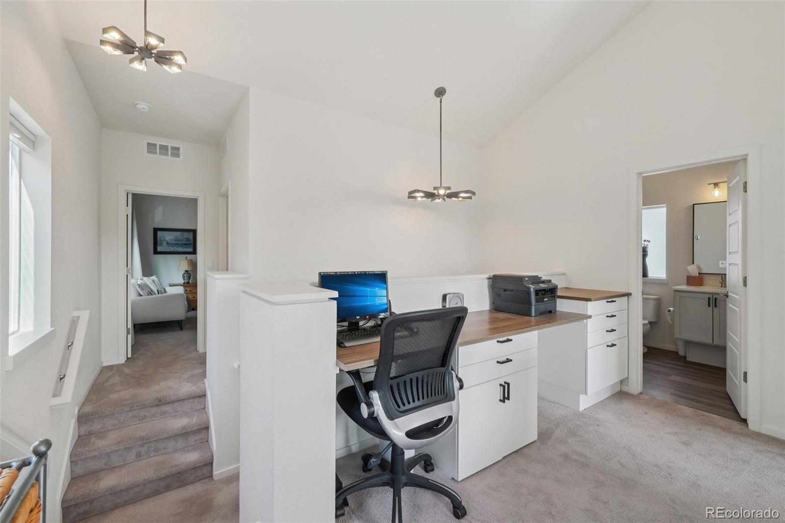 2005 West 66th Avenue Denver, CO 80221 - Photo 26 of 47 a room with a chair and gym equipment