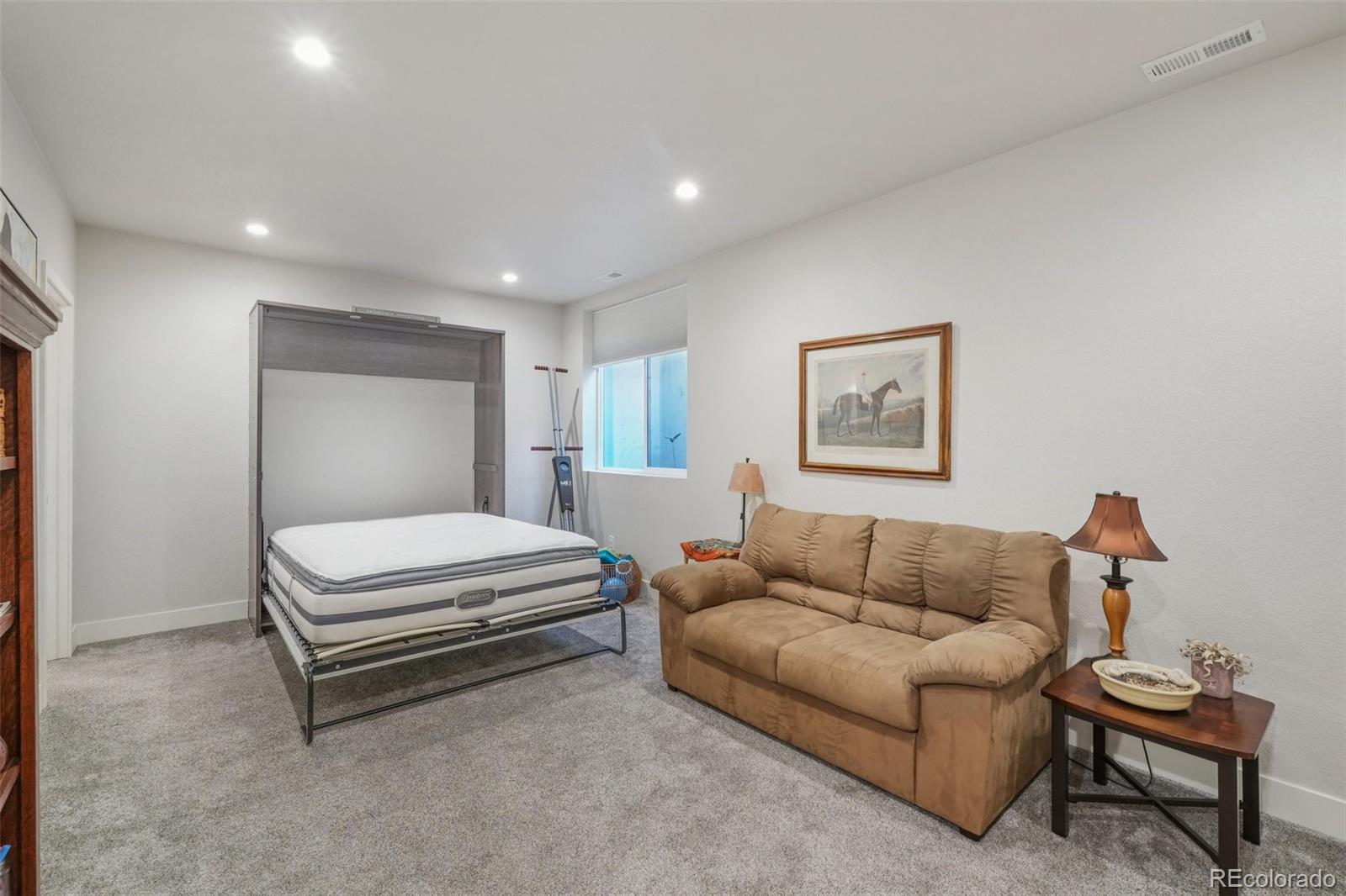 2005 West 66th Avenue Denver, CO 80221 - Photo 34 of 47 a bedroom with furniture and a couch