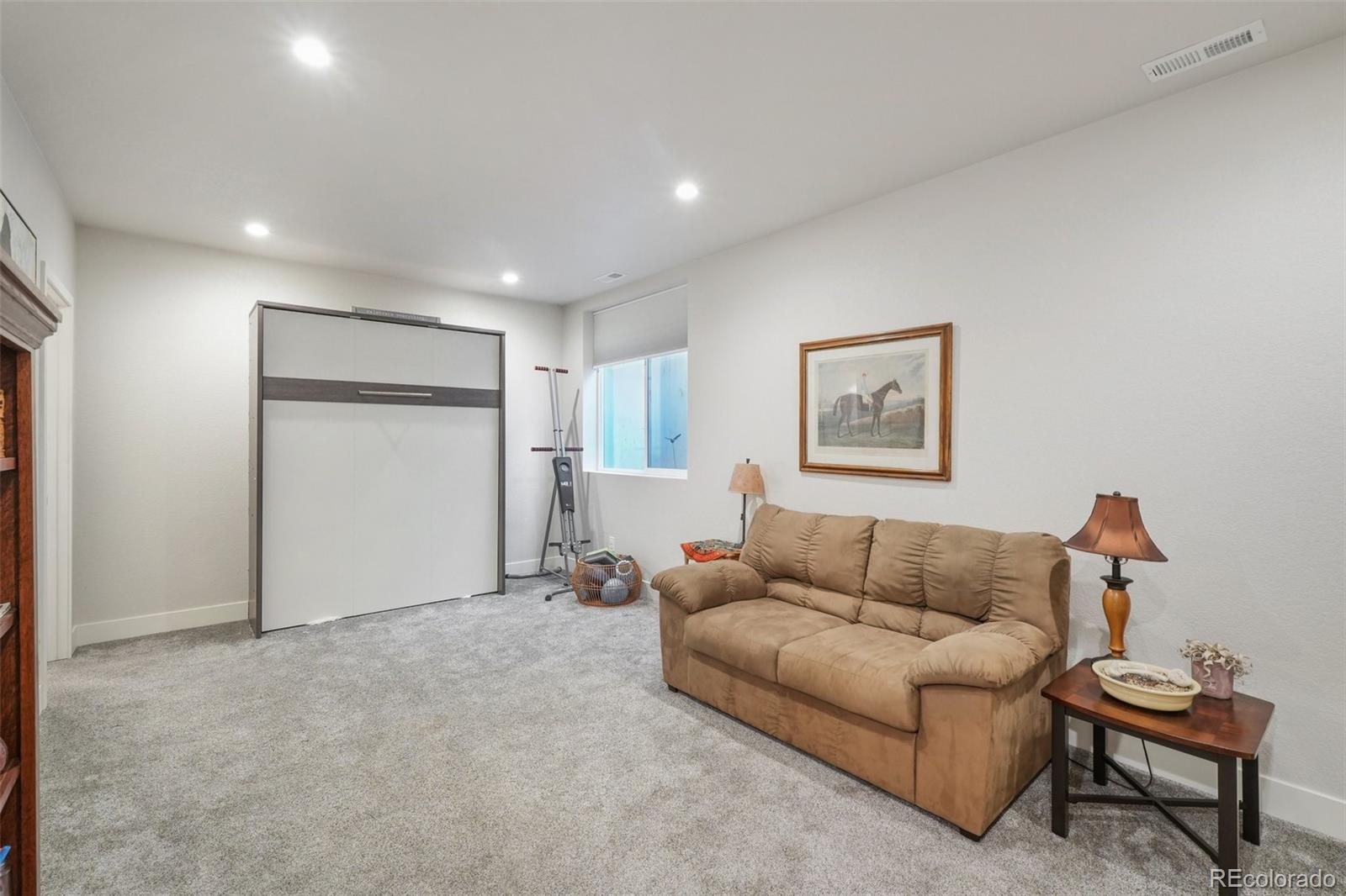 2005 West 66th Avenue Denver, CO 80221 - Photo 35 of 47 a living room with furniture and a couch