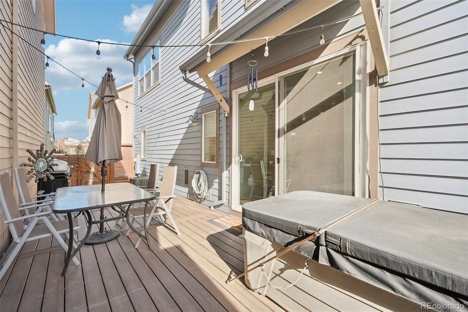 2005 West 66th Avenue Denver, CO 80221 - Photo 40 of 47 a view of a patio with wooden floor