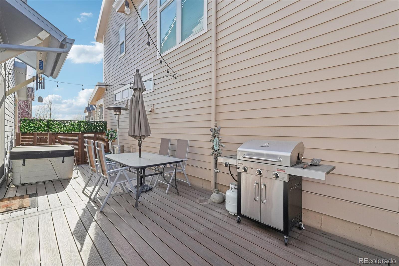 2005 West 66th Avenue Denver, CO 80221 - Photo 41 of 47 a view of a patio with table and chairs