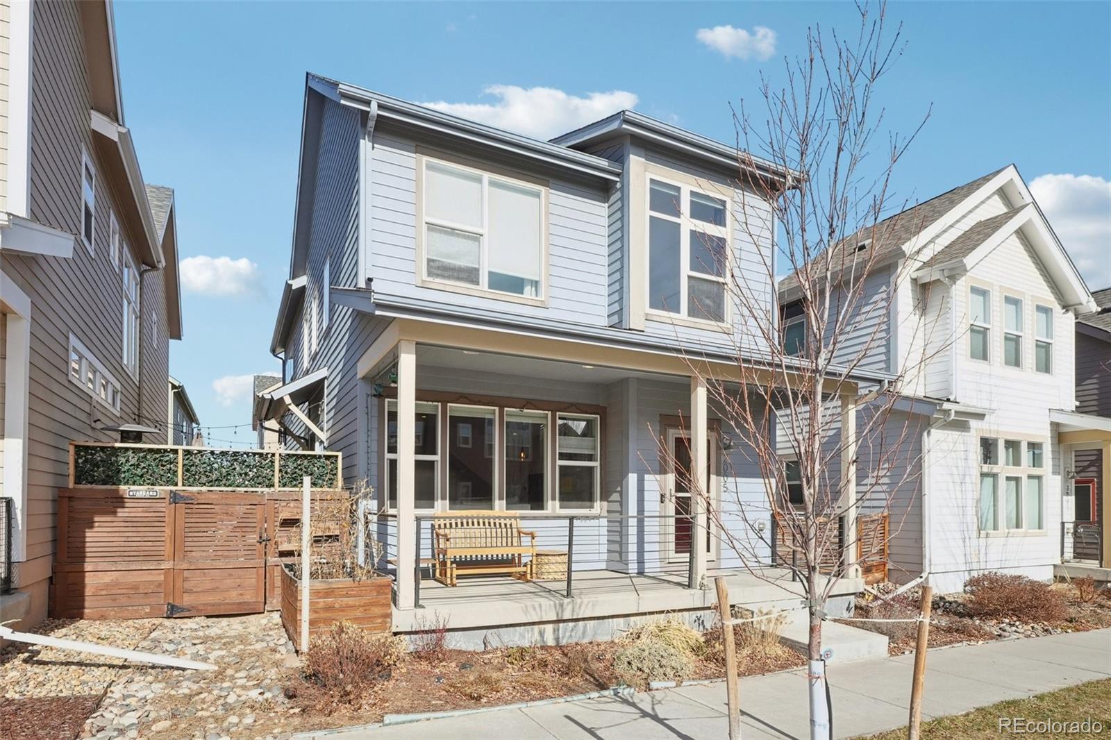 2005 West 66th Avenue Denver, CO 80221 - Photo 43 of 47 a view of a house with a iron gate