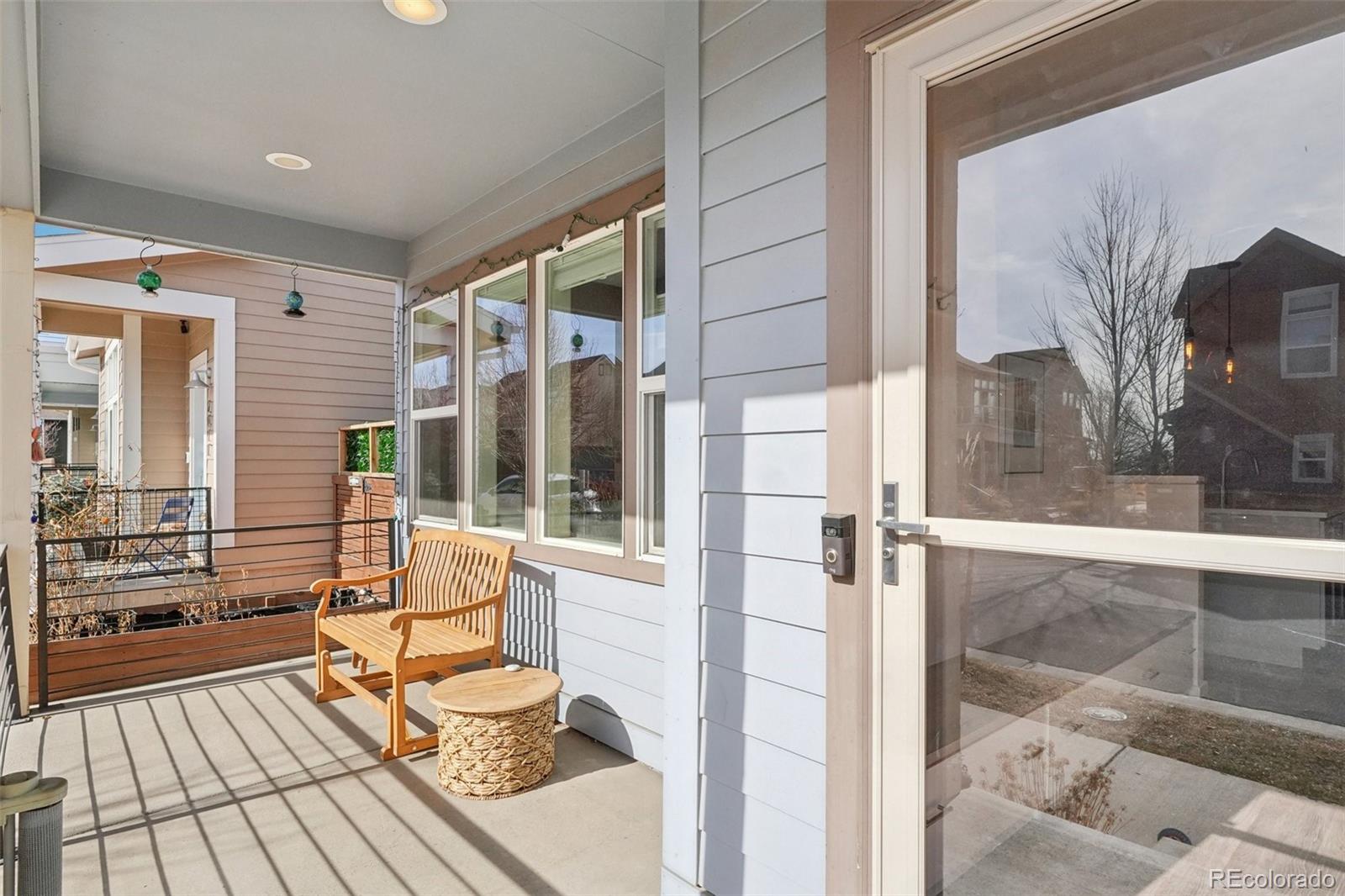 2005 West 66th Avenue Denver, CO 80221 - Photo 47 of 47 a balcony view with a couch and wooden floor