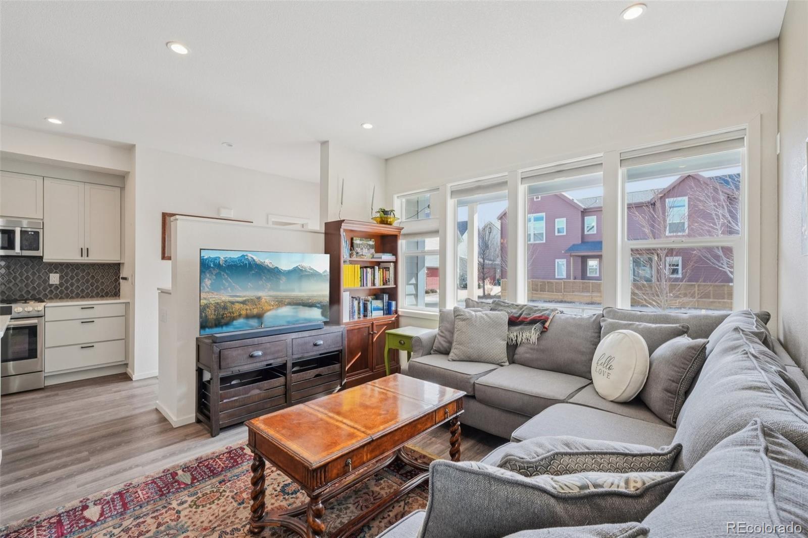 2005 West 66th Avenue Denver, CO 80221 - Photo 10 of 47 a living room with furniture and a flat screen tv