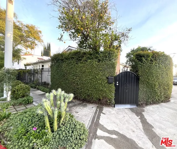 a view of a backyard of the house