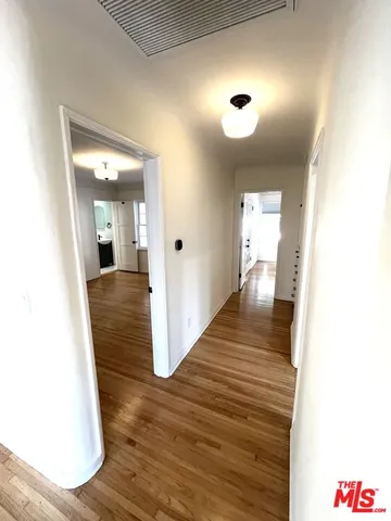 a room with a window and wooden floor