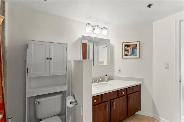 a bathroom with a sink vanity and a mirror