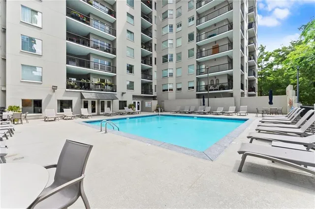 a view of a swimming pool and a yard