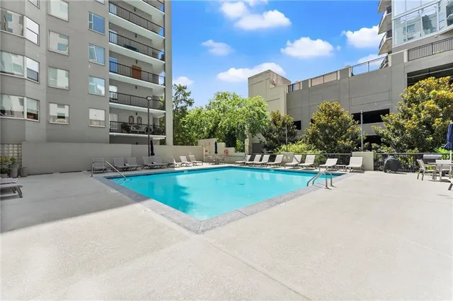 a view of a livingroom with furniture and windows