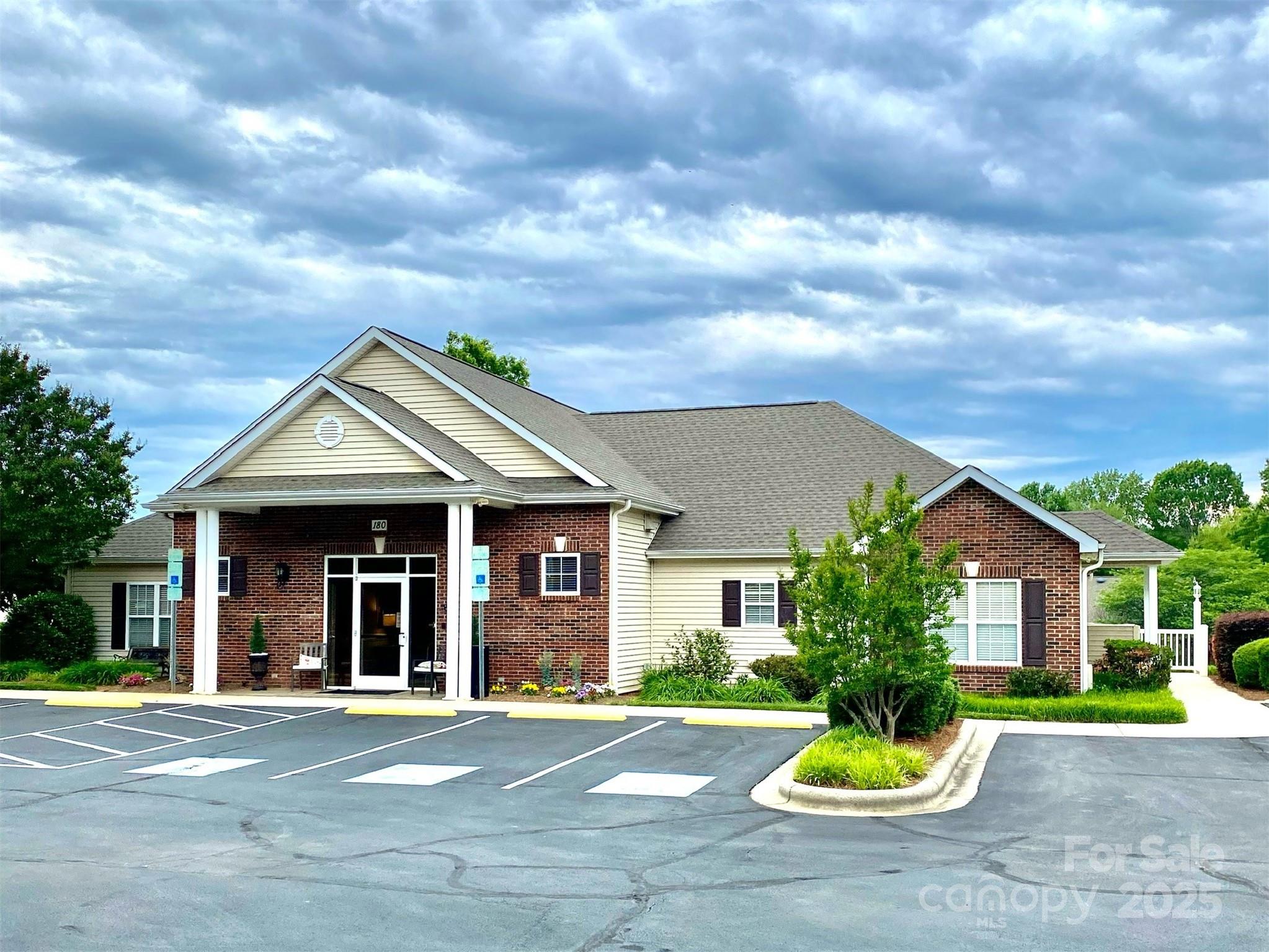 101 Keswick Lane Mooresville, NC 28117 - Photo 37 of 43 a front view of a house with a yard and potted plants