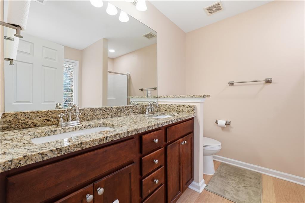 3110 Pittard Hill Point Duluth, GA 30096 - Photo 12 of 24 a bathroom with a granite countertop sink and a mirror