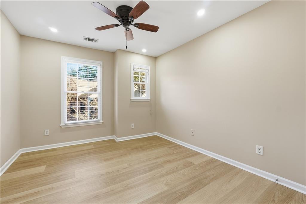 3110 Pittard Hill Point Duluth, GA 30096 - Photo 15 of 24 an empty room with a window and a ceiling fan