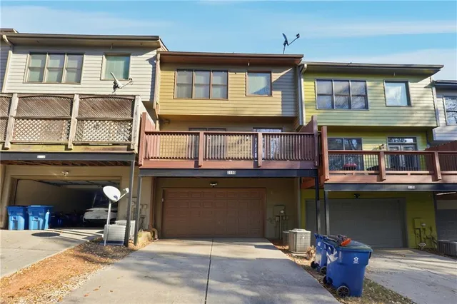 a front view of a house with a garage