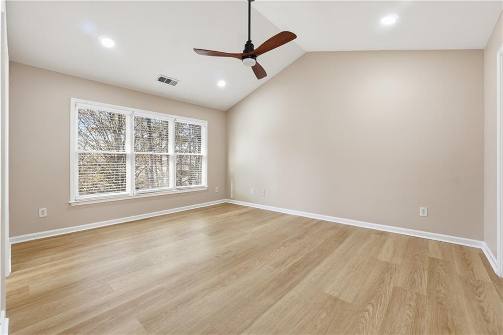 3110 Pittard Hill Point Duluth, GA 30096 - Photo 10 of 24 an empty room with window and a ceiling fan
