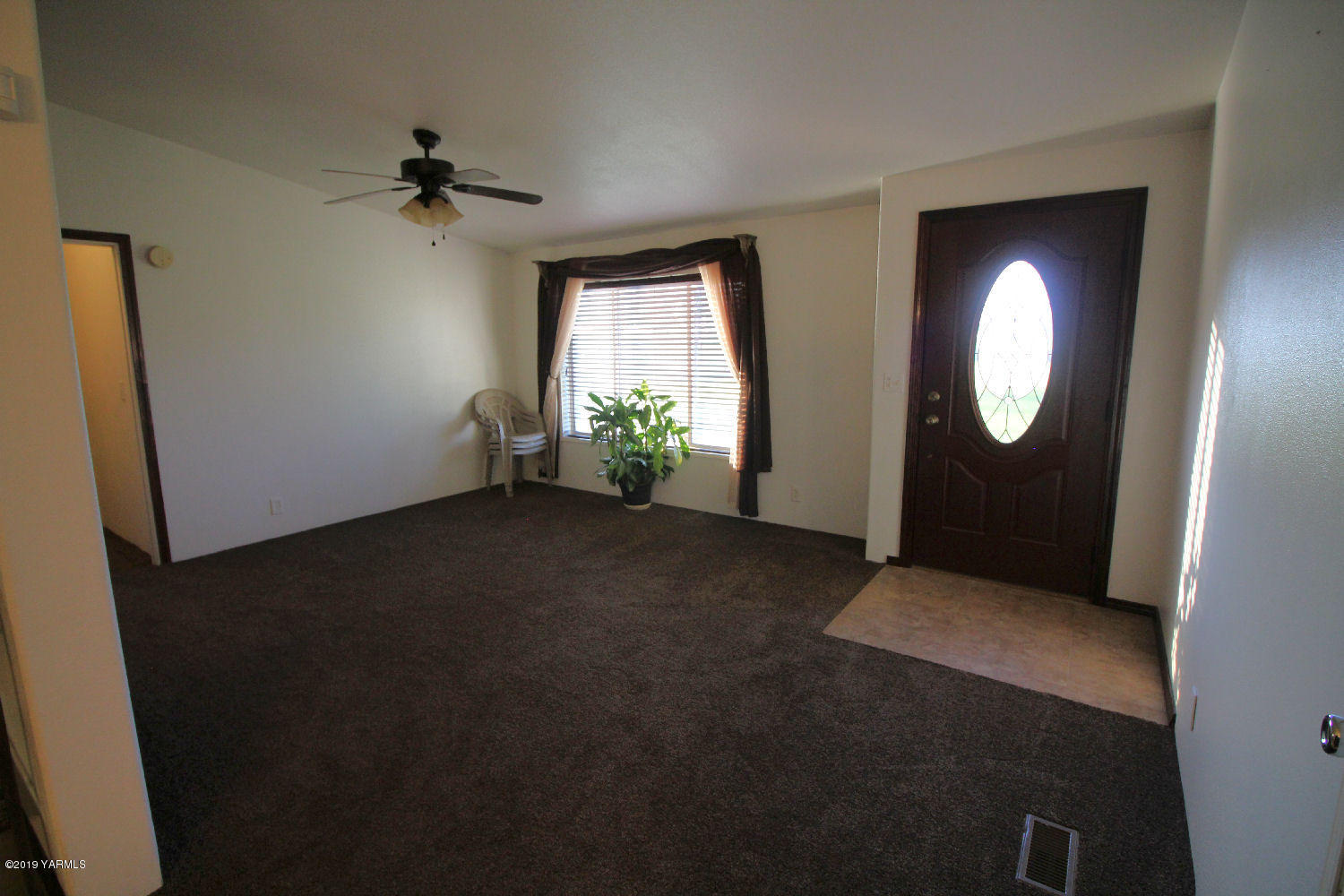 740 Barker Road Granger, WA 98932 - Photo 6 of 19 a view of empty room with windows