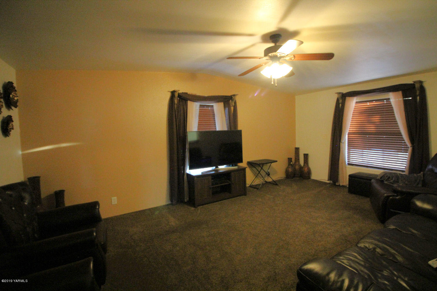 740 Barker Road Granger, WA 98932 - Photo 7 of 19 a living room with furniture and a flat screen tv