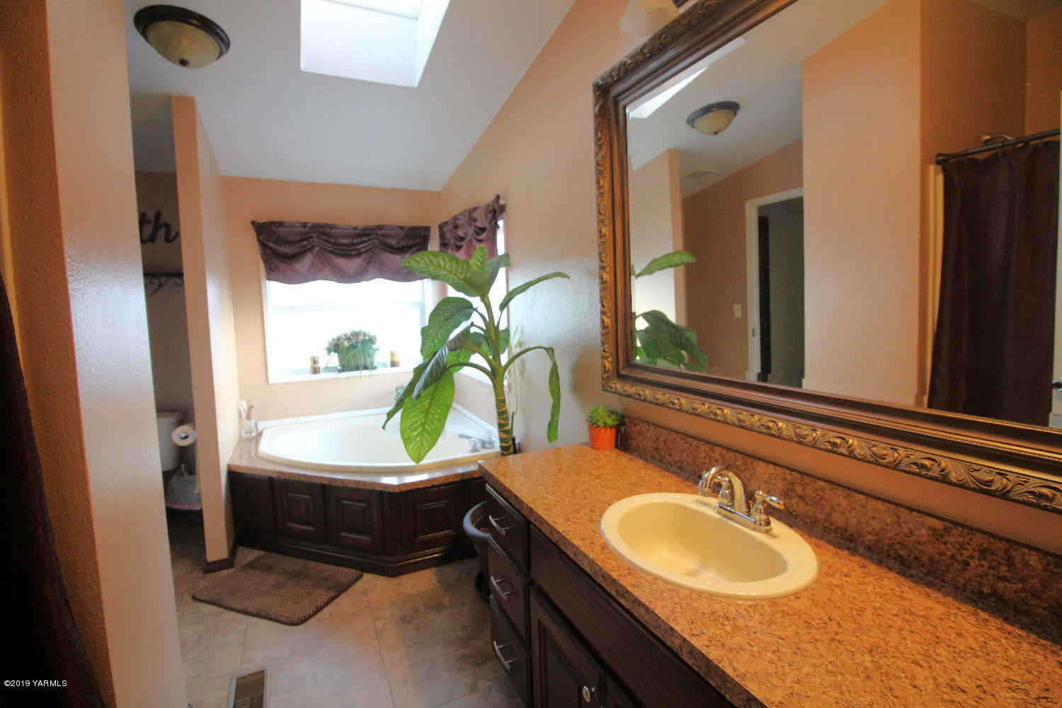 740 Barker Road Granger, WA 98932 - Photo 9 of 19 a bathroom with a double vanity sink and a mirror