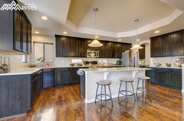 2405 Reed Grass Way Colorado Springs, CO 80915 - Photo 6 of 35 Another view of this great kitchen!