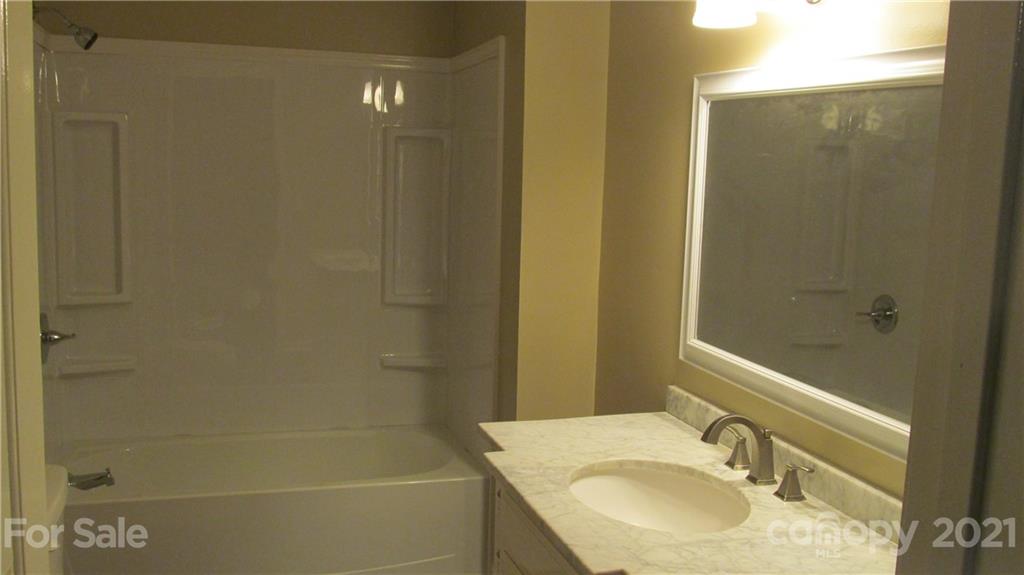 2896 Elbow Road Newton, NC 28658 - Photo 14 of 25 a bathroom with a sink toilet and shower