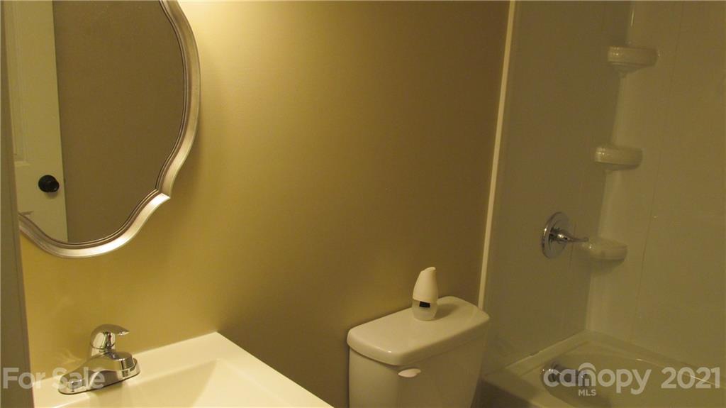 2896 Elbow Road Newton, NC 28658 - Photo 18 of 25 a bathroom with a sink and a toilet
