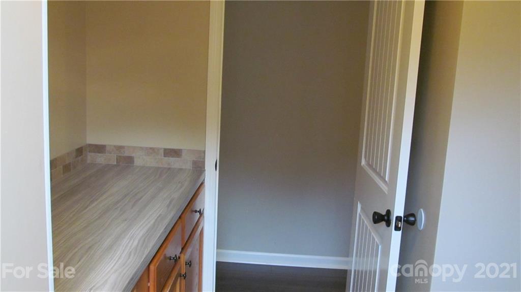 2896 Elbow Road Newton, NC 28658 - Photo 20 of 25 a bathroom with a granite countertop sink and vanity