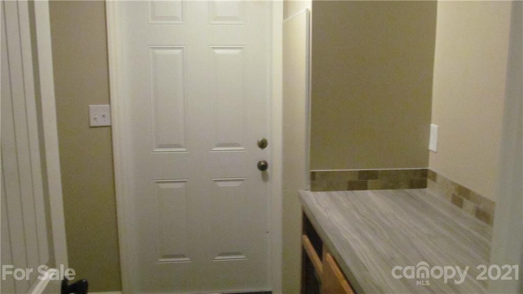 2896 Elbow Road Newton, NC 28658 - Photo 21 of 25 a bathroom with a granite countertop sink
