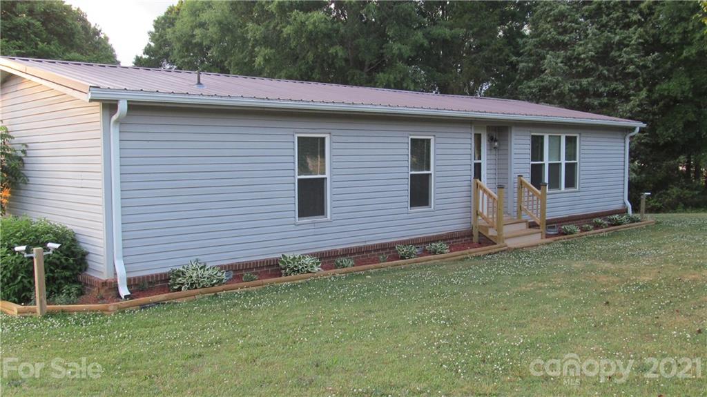 2896 Elbow Road Newton, NC 28658 - Photo 22 of 25 a front view of a house with a garden