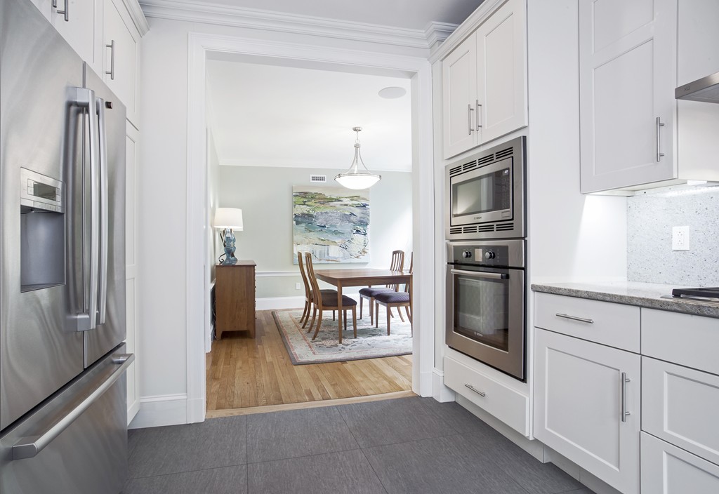 69 University Road, Unit 2 Brookline, MA 02445 - Photo 15 of 29 a kitchen with stainless steel appliances a refrigerator sink and stove