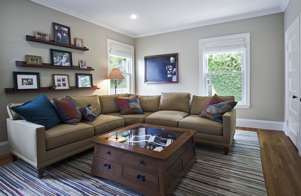 69 University Road, Unit 2 Brookline, MA 02445 - Photo 16 of 29 a living room with furniture and a window