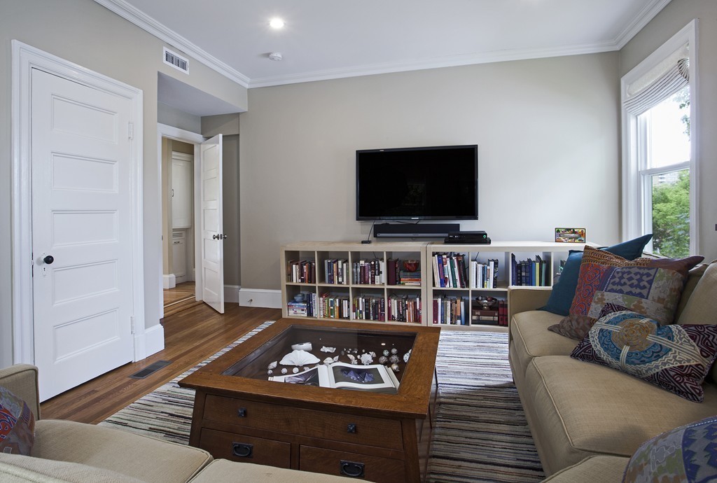 69 University Road, Unit 2 Brookline, MA 02445 - Photo 17 of 29 a living room with furniture and a flat screen tv