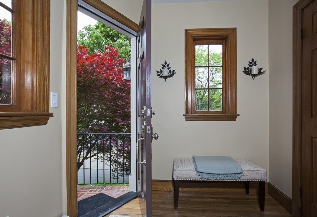 69 University Road, Unit 2 Brookline, MA 02445 - Photo 7 of 29 a bench sitting in front of a window with wooden floor