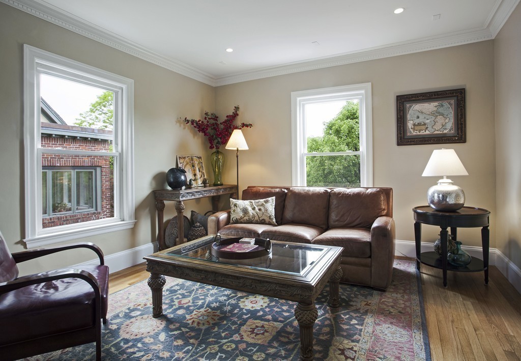 69 University Road, Unit 2 Brookline, MA 02445 - Photo 9 of 29 a living room with furniture a window and a lamp