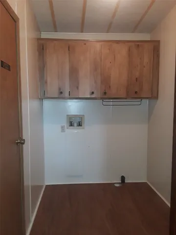 a view of storage and utility room with closet